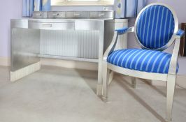 A SILVERED PAINTED DRESSING TABLE AND CHAIR.