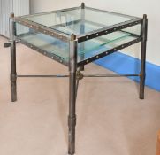 A PAIR OF MODERN GLASS-TOPPED SQUARE TWO-TIER TABLES. 1ft 8ins.