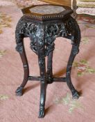 A CHINESE CARVED HARDWOOD PLANT STAND with octagonal top and hardstone. 2ft high.