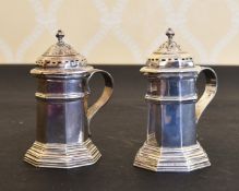 A PAIR OF OCTAGONAL SILVER PEPPERETTES with handles.London 1940.