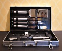 A GOOD SET OF BARBECUE TONGS AND A KNIFE in a case.