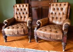 A GOOD PAIR OF VICTORIAN MAHOGANY GREEN STUDDED LEATHER ARMCHAIRS, with iron studs, on carved legs