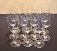 A SET OF ELEVEN LARGE PLAIN WINE GLASSES.
