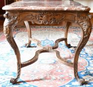 A GOOD FRENCH VEINED MARBLE TOP CENTRE TABLE with serpentine sides, on a wooden stand with carved