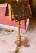 A VICTORIAN MAHOGANY DOUBLE SIDED MUSIC STAND on turned support and tripod legs.