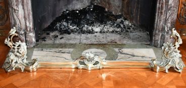 A BRASS ROCOCO FENDER. 4ft 4ins long.