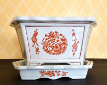 A CHINESE PORCELAIN RECTANGULAR JARDINIERE AND STAND. 1ft 2ins wide.