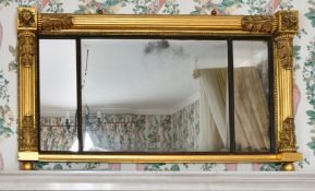 A LATE REGENCY GILTWOOD OVERMANTLE MIRROR with three mirrored panels. 4ft long x 2ft high.