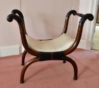 A MAHOGANY CROSS FRAME STOOL.