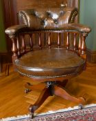 A GOOD MAHOGANY AND LEATHER TUB SWIVEL OFFICE CHAIR with buttoned back.