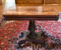 A GOOD LATE REGENCY ROSEWOOD TEA TABLE with folding top, centre column, platform base with four claw