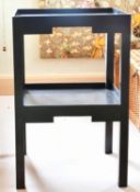 A PAIR OF TWO-TIER TABLES.