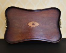 AN EDWARDIAN MAHOGANY INLAID TWO-HANDLED TEA TRAY.
