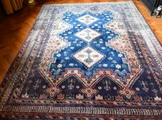 A GOOD PERSIAN RUG with three central diamond medallions. 7ft 9ins x 5ft 9ins.