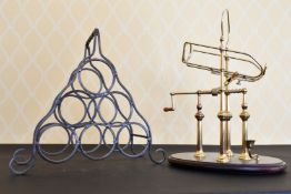 A WINE BOTTLE STAND AND CORKSCREW STAND.