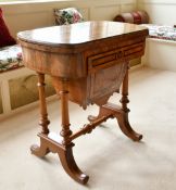 A GOOD VICTORIAN WALNUT GAMES AND SEWING STAND, the folding top opening to reveal backgammon,