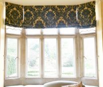 A FULL-LENGTH CURTAIN AND FIVE BEDS.