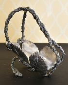 A PLATED FRUITING VINES BOTTLE STAND.