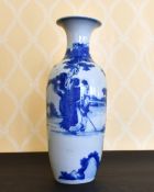 A KANG HSI BLUE AND WHITE VASE painted with figures. 14ins high.