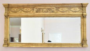 A GILTWOOD LONG OVERMANTLE MIRROR with urn and ribbon motifs. 5ft 4ins long x 2ft 9ins high.