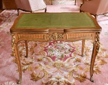 AN 18TH CENTURY FRENCH BUREAU PLAT with pull-out ends, set with green leather with rich ormolu