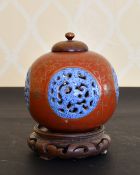 A CHINESE REPUBLIC RED PORCELAIN PIERCED BULBOUS VASE AND COVER IN THE CHIEN LONG STYLE