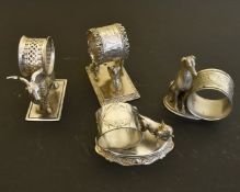 FOUR NOVELTY PLATE ANIMAL SERVIETTE RINGS.