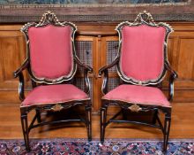 A GOOD PAIR OF ITALIAN GILDED ARMCHAIRS with padded backs, drop-in seats, on tapering legs.