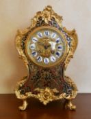 A MID 19TH CENTURY, FRENCH, BOULLE MANTLE CLOCK, the shaped body with all-over cut brass and
