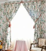 TWO PAIRS OF FLORAL FULL-LENGTH CURTAINS, PELMETS AND MIRRORS. 1ft 2ins diameter.