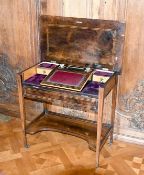A VICTORIAN ROSEWOOD INLAID SIDE TABLE, the flap opens to reveal a desk, on tapering legs with