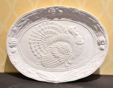 A LARGE WHITE OVAL TURKEY DISH.