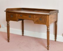 A WILLIAM IV MAHOGANY TABLE with three drawers, on fluted legs. 3ft 8ins long.