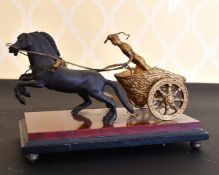 A BRONZE CHARIOT AND HORSES.