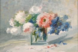 20th century, A still life of mixed flowers in a glass vase, oil on canvas laid down, indistinctly