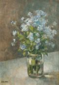 Brian Nolan 20th century British school, A still life of blue flowers in a glass vase, oil on board,
