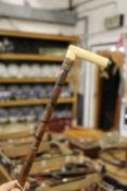 A ivory handle bamboo walking stick