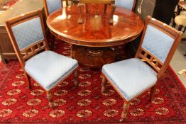 A set of four Victorian walnut dining chairs with upholstered backs and seats