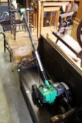 A Weed Eater petrol operated lawn edger