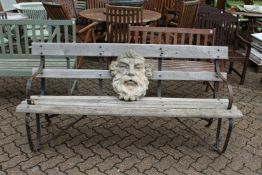 A good wrought iron and wooden garden bench