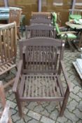 A good set of four wooden garden armchairs