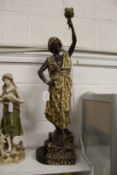 A large painted spelter figural table lamp
