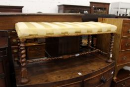 A long stool with barley twist legs and stretchers