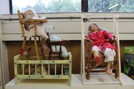 A dolls cot, two high chairs and similar items to include dolls