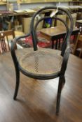 A Thonet childs ebonised bentwood armchair