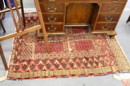 An old Persian Tekke style rug (worn)