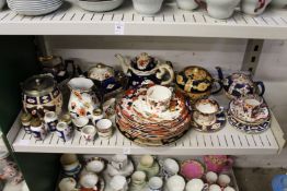 A quantity of lustre decorated china to include teapots together with Masons ironstone plates and