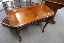 A Victorian walnut foldover card table