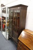 A mahogany two door display cabinet/bookcase on later stand