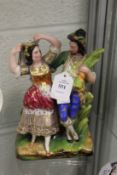 A pottery group of a Turkish man and woman dancing